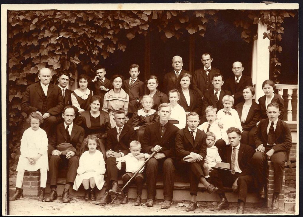 Funeral photograph for Tip Wilson dated 1921. Seated at center is Naomi Elizabeth “Lizzie” (Cox) Wilson.