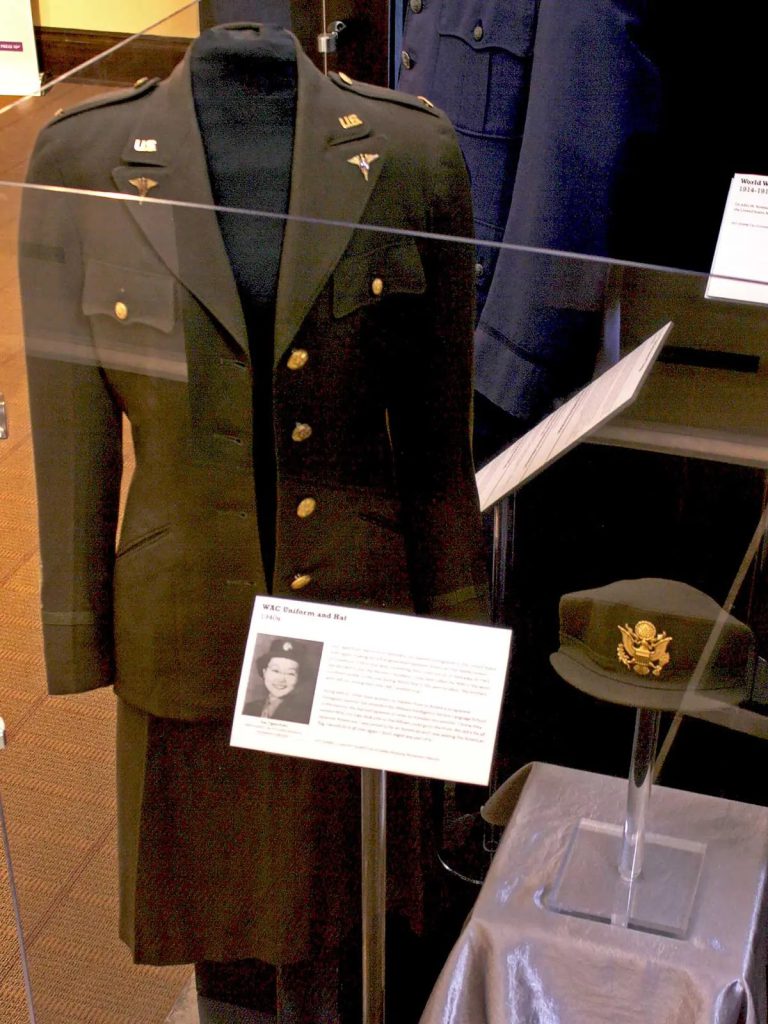 Here is another example of a mannequin being too large. In this case they have chosen not to button up the WWII WAC uniform. This was the correct choice as it is still fully supported on the mannequin form and buttoning it would have caused undue stress on the garment. Also notice the black lining on the dress form to protect the garment.