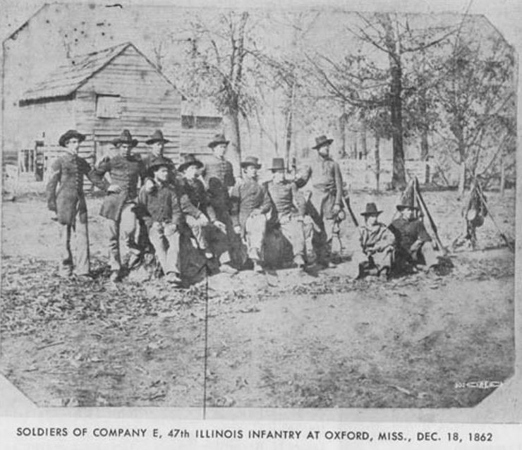 Photo of soldiers from Company E, 47th Illinois Infantry at Oxford, Mississippi taken on December 18, 1862 via Civil War Centennial Commission of Illinois.