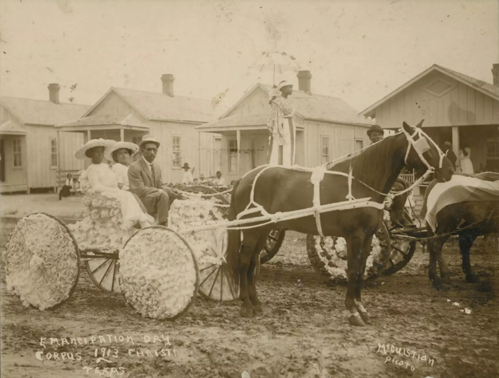 Emancipation Day parade participants in Corpus Christi on June 19, 1913. Note the woman standing in the buggy behind the closest one. Courtesy DeGolyer Library, Southern Methodist University
