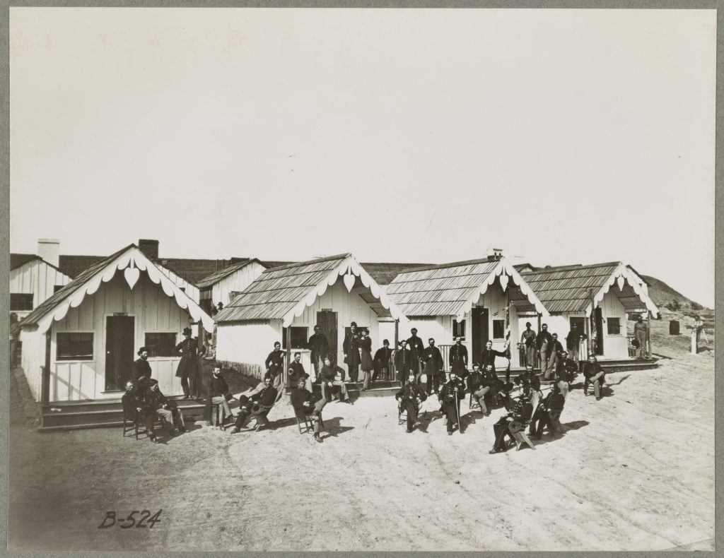 Headquarters of the 21st Michigan Infantry. 1865 (?) based on other photographs this camp was in Chattanooga Tn around November 1864.