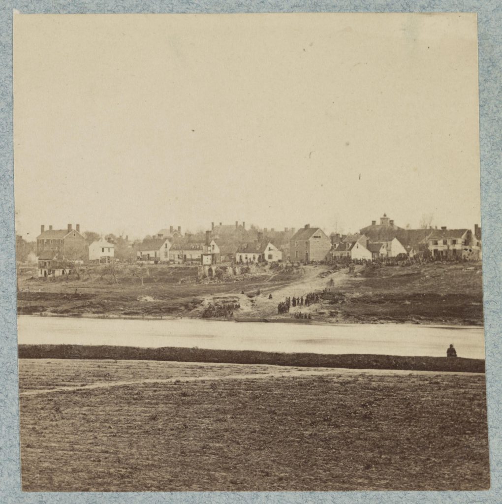 Image of wounded soldiers being moved across the Rappahannock River under flag of truce after the Battle of Chancellorsville.